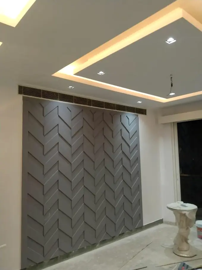 Herringbone wall panelling being fixed to a bedroom wall